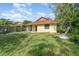 Backyard featuring the home's exterior, a patio, and a privacy fence at 1007 Glendale St, Orlando, FL 32807
