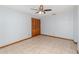 Bright bedroom with wood trim, neutral tile floors, and a spacious closet at 1007 Glendale St, Orlando, FL 32807