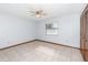 This bedroom has tile floors, a ceiling fan, and a large closet space at 1007 Glendale St, Orlando, FL 32807