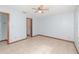 Bedroom featuring tile floors, ceiling fan, and wood trim around the base of the walls at 1007 Glendale St, Orlando, FL 32807