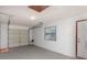 Spacious garage featuring painted walls, window, and garage door with opener hardware at 1007 Glendale St, Orlando, FL 32807