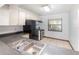 Traditional style kitchen with stainless steel appliances, white cabinetry and a double stainless steel sink at 1007 Glendale St, Orlando, FL 32807