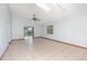 Bright and airy living room with tiled floors, sliding glass doors, and a large window at 1007 Glendale St, Orlando, FL 32807