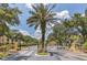 View of the gated entrance to the condominium community with manicured landscaping and trees at 1125 Lake Shadow Cir # 5109, Maitland, FL 32751