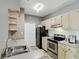 Well-lit kitchen with stainless steel appliances, ample cabinet space and wood-look floors at 1125 Lake Shadow Cir # 5109, Maitland, FL 32751