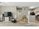 Cozy living room featuring wood-look floors, television and rocking chair at 1125 Lake Shadow Cir # 5109, Maitland, FL 32751