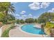 Beautiful pool area with tropical landscaping, plenty of chairs and a lush tropical garden at 1125 Lake Shadow Cir # 5109, Maitland, FL 32751