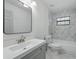 Renovated bathroom featuring modern vanity, tile backsplash, and updated fixtures at 11540 Harbor Rd, Leesburg, FL 34788
