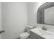 Neat bathroom with modern sink, toilet, and stylish, reflected shower with marble-style tiling at 11540 Harbor Rd, Leesburg, FL 34788