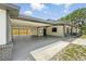 Expansive covered carport providing ample parking and featuring access to backyard at 11540 Harbor Rd, Leesburg, FL 34788