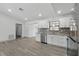 Contemporary kitchen with stainless steel appliances and new flooring at 11540 Harbor Rd, Leesburg, FL 34788