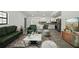 Beautiful living room with grey floors, plush rug, and tasteful furniture at 11540 Harbor Rd, Leesburg, FL 34788