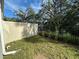 Landscaped backyard with privacy fence offers a serene outdoor space at 1205 Southstation Pl # 208, Orlando, FL 32809