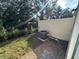 Cozy backyard featuring a fence, some trees, and an air conditioning unit at 1205 Southstation Pl # 208, Orlando, FL 32809