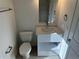 Bathroom featuring a toilet, vanity with storage, and modern fixtures at 1205 Southstation Pl # 208, Orlando, FL 32809
