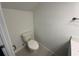 Compact powder room with a white toilet and modern fixtures at 1205 Southstation Pl # 208, Orlando, FL 32809
