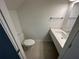 Stylish powder room features a sleek floating vanity and modern fixtures at 1205 Southstation Pl # 208, Orlando, FL 32809