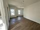 Spacious bedroom features two windows with neighborhood views at 1205 Southstation Pl # 208, Orlando, FL 32809