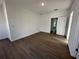 A bedroom with neutral walls and wood-look flooring at 1205 Southstation Pl # 208, Orlando, FL 32809