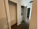 A laundry closet contains a stacked washer and dryer unit at 1205 Southstation Pl # 208, Orlando, FL 32809