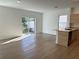Living space leading to kitchen with sliding glass doors to the backyard at 1205 Southstation Pl # 208, Orlando, FL 32809