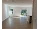 Spacious living room with sliding glass doors, offering lots of natural light at 1205 Southstation Pl # 208, Orlando, FL 32809