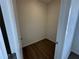 A bright walk-in closet features wood floors and ample storage space at 1205 Southstation Pl # 208, Orlando, FL 32809
