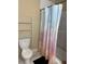 Bathroom featuring white toilet and shower curtain with cloud design at 1218 37Th St, Orlando, FL 32805