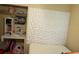 Small bedroom with unique white geometric headboard and a desk at 1218 37Th St, Orlando, FL 32805
