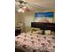 Cozy bedroom with ceiling fan, and large art piece of a beach scene at 1218 37Th St, Orlando, FL 32805