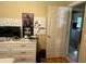 Bedroom with built in dresser, desk, art, and laundry room access at 1218 37Th St, Orlando, FL 32805