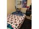 Small bedroom with custom sheets, carpet, and a dark dresser at 1218 37Th St, Orlando, FL 32805