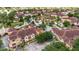 Aerial view of a residential community featuring townhomes, lush landscaping, and tree-lined streets at 12414 Baleria Cv # 104, Orlando, FL 32837
