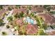Overhead view of a residential community featuring a pool, landscaping, and neatly arranged homes at 12414 Baleria Cv # 104, Orlando, FL 32837