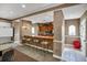 A well-equipped bar area with seating for patrons and ample space for entertaining guests at 12414 Baleria Cv # 104, Orlando, FL 32837