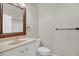 Bathroom with vanity, toilet, and mirror at 12414 Baleria Cv # 104, Orlando, FL 32837