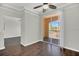 Bedroom with dark wood floors and glass doors leading to a balcony at 12414 Baleria Cv # 104, Orlando, FL 32837
