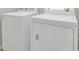 A laundry room with a white washing machine and a dryer at 12414 Baleria Cv # 104, Orlando, FL 32837