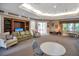 A comfortable lounge area with cozy seating, a built-in entertainment center, and natural light, ideal for socializing at 12414 Baleria Cv # 104, Orlando, FL 32837