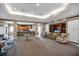 A spacious lounge area featuring a bar, seating, and entertainment center with a television, perfect for relaxation at 12414 Baleria Cv # 104, Orlando, FL 32837