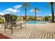 Community pool with lounge chairs for relaxing and enjoying the beautiful Florida weather at 12414 Baleria Cv # 104, Orlando, FL 32837