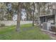 Large backyard with lush green grass and playset, ideal for outdoor activities and relaxation at 1307 Pup Fish Ln, Deland, FL 32724
