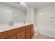 Bathroom featuring double sink vanity and shower-tub combo at 1307 Pup Fish Ln, Deland, FL 32724