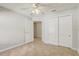 Neutral bedroom offers a ceiling fan, closet, and white doors, trim, and walls at 1307 Pup Fish Ln, Deland, FL 32724