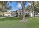 A well-maintained home on a green lawn, showcasing curb appeal with mature landscaping at 1307 Pup Fish Ln, Deland, FL 32724