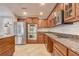 Kitchen featuring stone countertops and stainless appliances at 1307 Pup Fish Ln, Deland, FL 32724