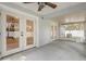 Spacious screened lanai with ceiling fan, offering an ideal space for outdoor living and relaxation at 1307 Pup Fish Ln, Deland, FL 32724