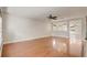 Bright living room featuring hardwood floors and mirrored accent wall at 1307 Pup Fish Ln, Deland, FL 32724