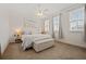 Bright bedroom with a ceiling fan, large windows, and neutral decor at 13208 Leggett Aly, Orlando, FL 32827