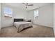 Cozy bedroom features carpet, a ceiling fan and a window with bright natural light at 13208 Leggett Aly, Orlando, FL 32827